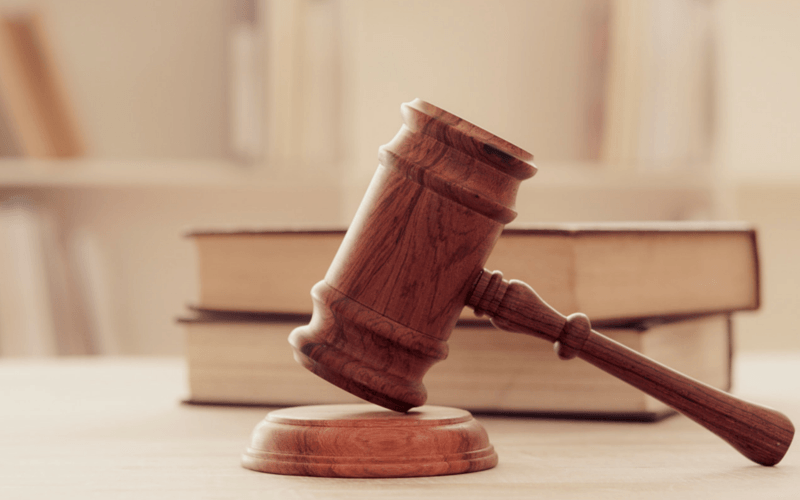 Judge’s gavel and legal books symbolising justice, court decisions, or legal authority