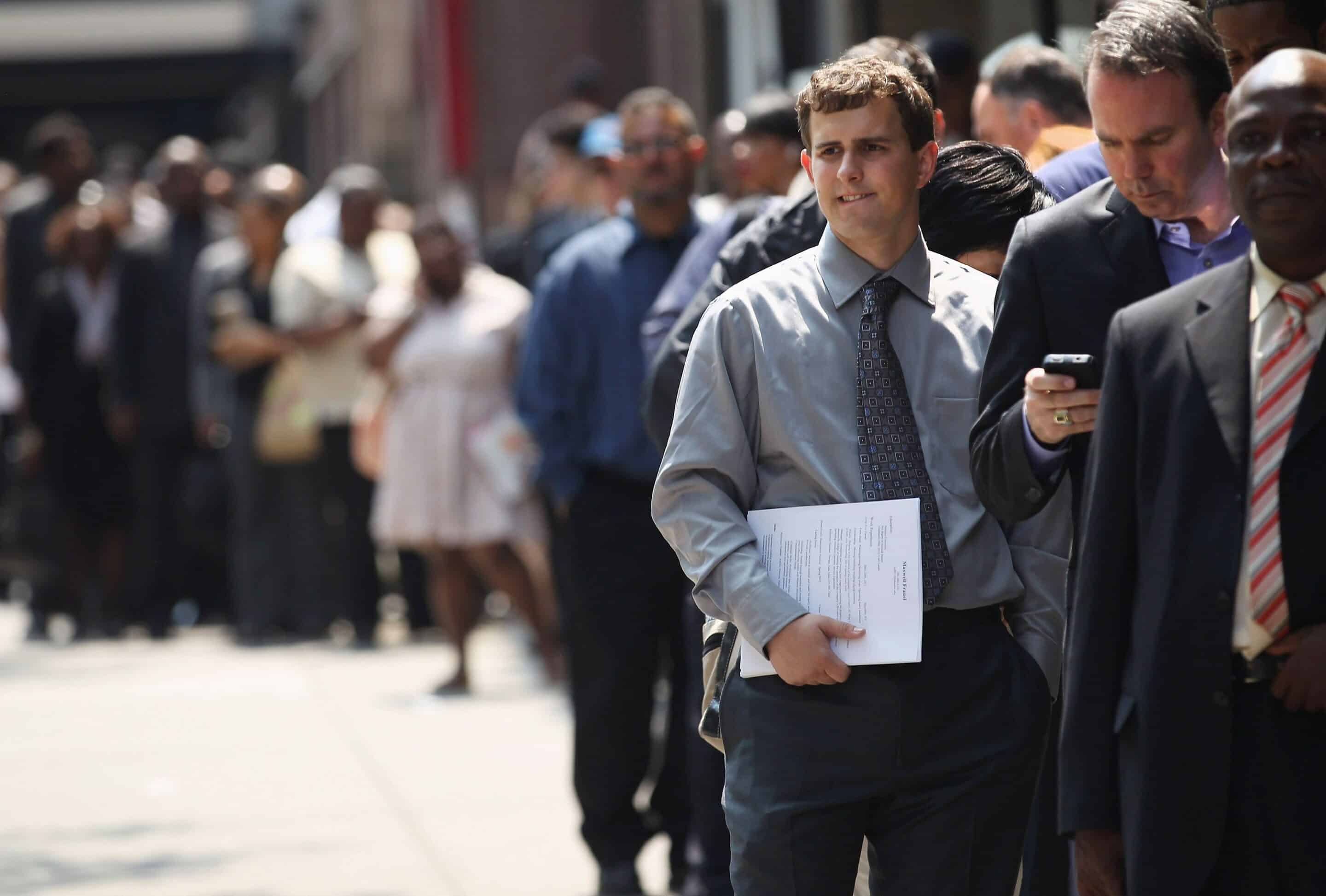 Line of job seekers symbolising the challenges of unemployment