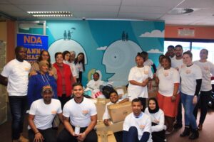 NDA team members collaborating during a charity initiative